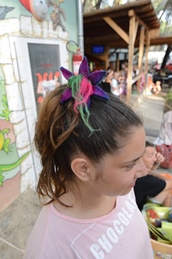 A person with a colorful star-shaped hair accessory