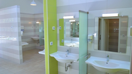 Modern public restroom with sinks and mirrors