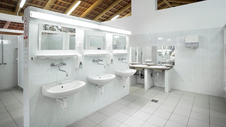 Modern restroom with multiple sinks and mirrors