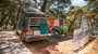 Camping setup with a van and laundry drying in Bijar